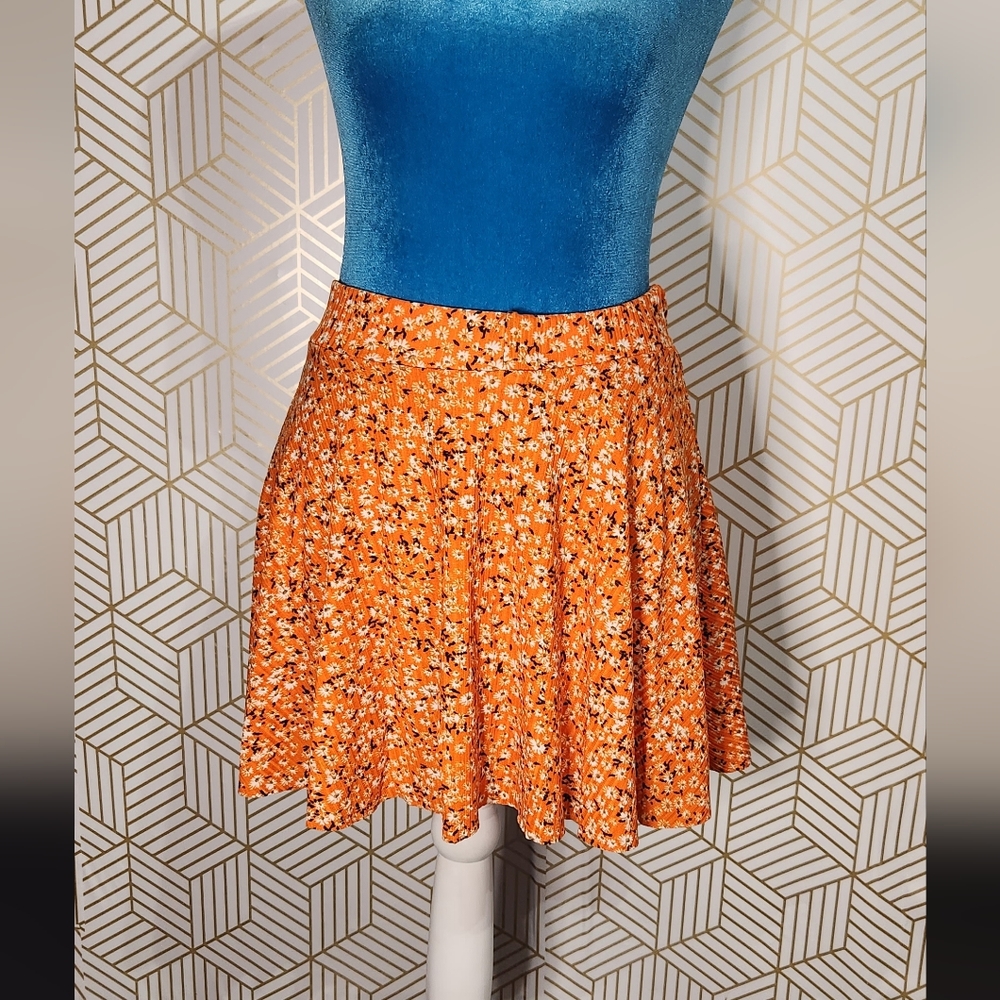 Orange floral skirt with shorts underneath  (Size S)